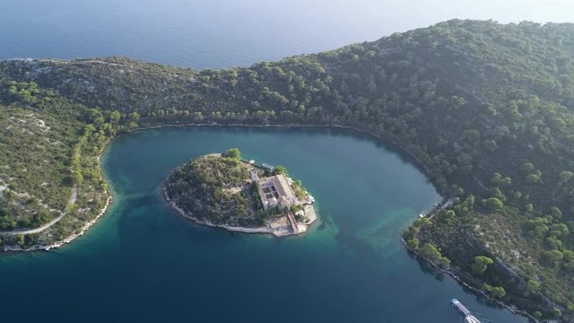 Aerial view of the Mljet National Park in Croatia with Veliko and Malo Lakes. Drone footage of St. Mary's island and its amazing Benedictine monastery. Concept: holidays and tourist attraction in Croa