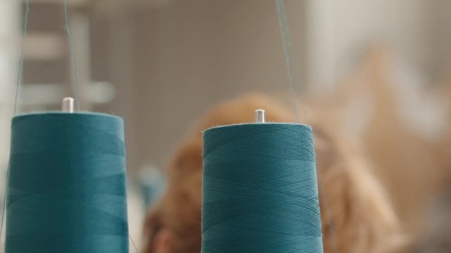 spool of thread on a sewing machine