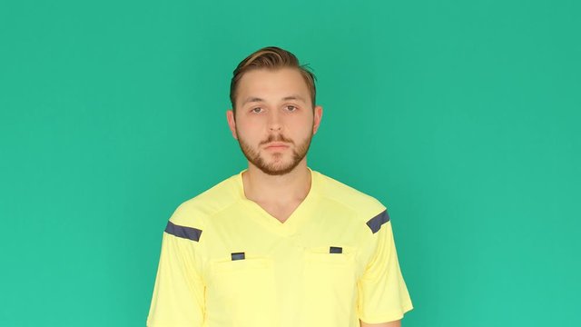 Football Soccer referee on green screen showing VAR Video Assistant Referee with hands, 4k