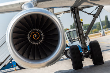 Aircraft jet engine detail in the exposition. Turbine Engine Profile. Aviation Technologies. Airport background