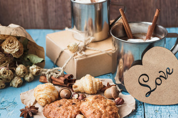 Metal mugs with cacao and marshmallows