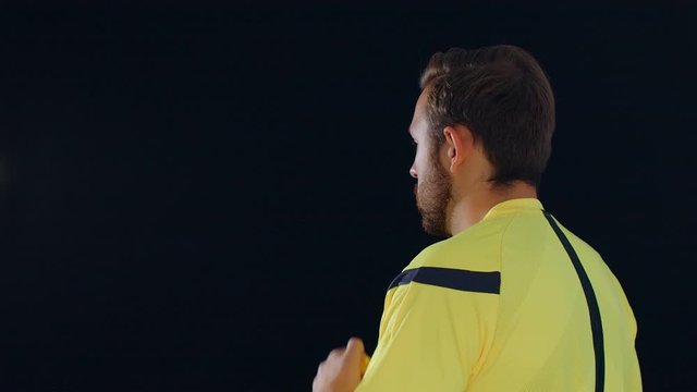 Football Soccer referee on black background showing VAR Video Assistant Referee with hands, 4k slow motion