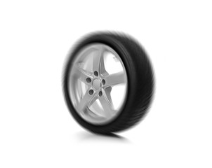 Spinning car wheel isolated on white background.