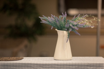 bouquet of flowers in a vase on wooden table