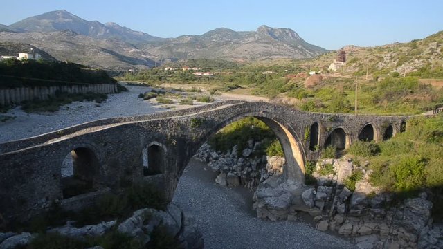 Albanian Countryside. Rural landscape in northwestern Albania, Balkans, Europe. Mountains, valley, river and hills. Mesi Bridge, Ura e Mesit, Shkoder. Monument of Postrib&euml; culture. Architecture