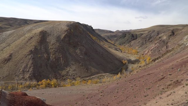 Martian sandy landscape with hills, river and road near the Altai mountains.