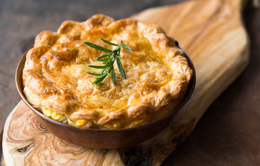 Individual chicken pot pie with puff pastry crust. top view © Maria