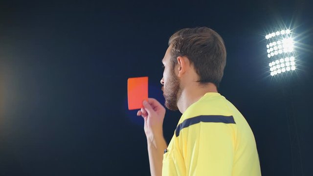 Football Soccer referee on green screen shows penalty red card, 4k