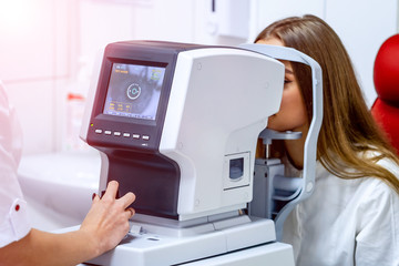 Cheerful female patient having her vision checked