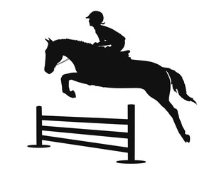 Silhouette of a child is learning on a pony show jumping