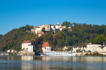Fototapeta na wymiar River cruising on river Danube in front of Oberhaus castle in Passau, Germany