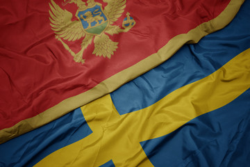 waving colorful flag of sweden and national flag of montenegro.