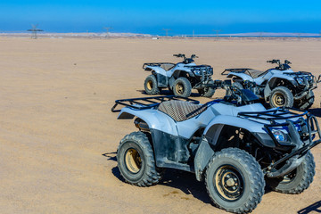 Fototapeta na wymiar Quad bikes in Arabian desert not far from the Hurghada city, Egypt