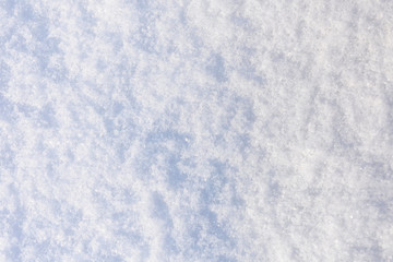 Texture of the white fluffy snow for background