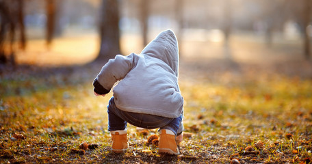 Toddler boy playing outdoors