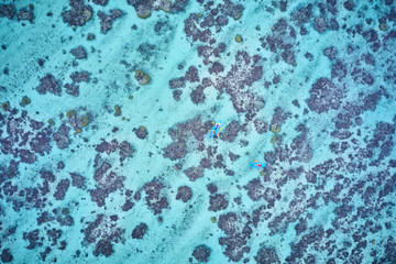 Kayaking on pristine blue water in Fiji from a 5 star resort drone aerial