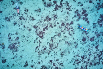 Kayaking on pristine blue water in Fiji from a 5 star resort drone aerial