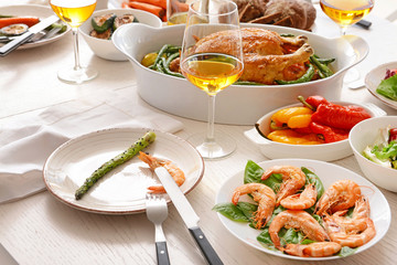Many dishes served on table for big family dinner