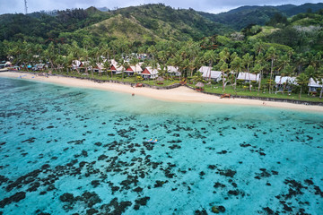Kayaking on pristine blue water in Fiji from a 5 star resort drone aerial