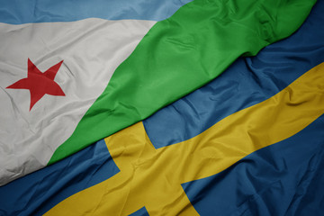 waving colorful flag of sweden and national flag of djibouti.