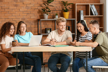 Group of students preparing for exam in university