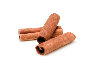 Cinnamon sticks for cooking and cosmetics. Close up macro isolated on white background with shadow. Full depth of field, high resolution.