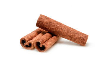 Cinnamon sticks for cooking and cosmetics. Close up macro isolated on white background with shadow. Full depth of field, high resolution.