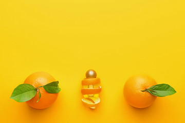 Composition with orange essential oil on color background