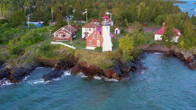 Michigan's Upper Peninsula, Eagle Harbor Lighthouse. Remote outpost at the Northern tip of the Keweenaw Peninsula in Lake Superior, amid windy autumn dawn.