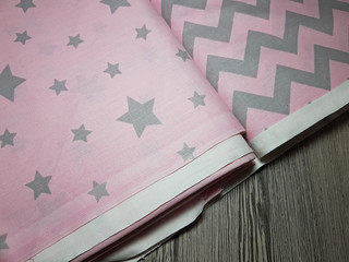 Pink fabric with a zigzag pattern. Textiles, close-up photos.