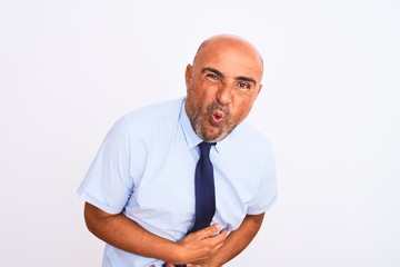 Middle age businessman wearing tie standing over isolated white background with hand on stomach because nausea, painful disease feeling unwell. Ache concept.