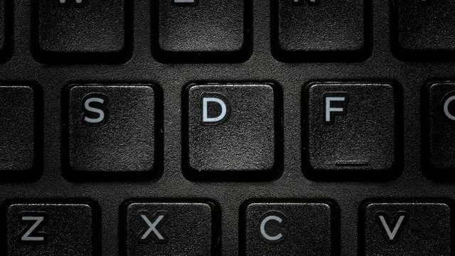 Computer PC Keyboard Letters close up macro. Camera handheld and fast transition Alphabet