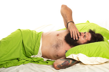 Sleeping quietly calmly. Sleeping time. Photo of handsome man sleeping and holding soft green...