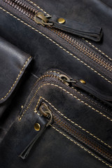 Leather bag in vintage style with zipper, pocket and stitches, casual man accessories, macro shot, selective focus 