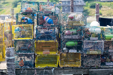 Lobster Traps piled up on a dock in Maine