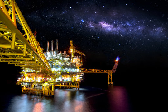 Industrial Offshore Oil And Gas,Oil Rig Platform With Milky Way At Night