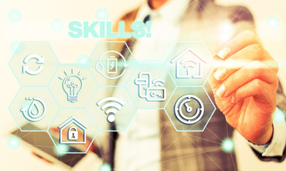 Word writing text Skills. Business photo showcasing ability do something very well by nature Female human wear formal work suit presenting presentation use smart device