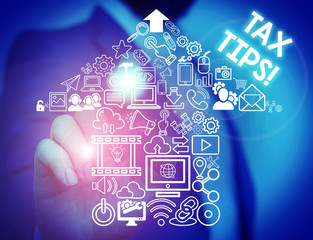 Handwriting text Tax Tips. Conceptual photo compulsory contribution to state revenue levied by government Male human wear formal work suit presenting presentation using smart device