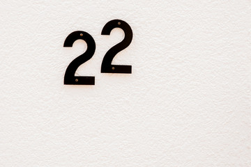 Number 22 on white background with space for text.