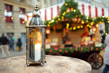 Lantern as a decoration of a wooden table on Christmas market in Vilnius, Lithuania.