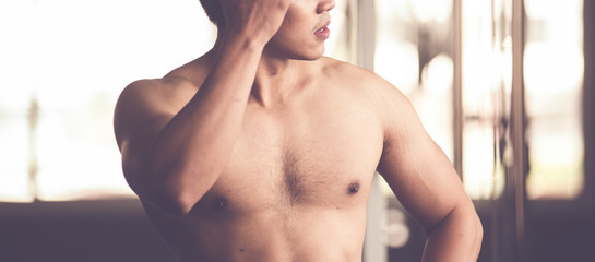 A close-up of a young man exercising