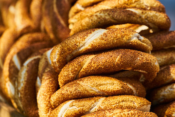 fresh baked hot bagels with sesame seeds