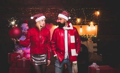 Portrait of a young beautiful smiling couple in home Christmas mood. Love. Positive human emotions facial expressions. Christmas bomb. Creative boom.