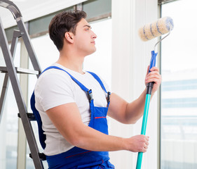 Painter repairman working at construction site