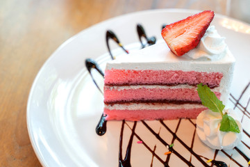 Homemade strawberry yogurt cake decorated with fresh fruits.