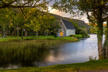 Fototapeta na wymiar Beautiful sunset view aat Gougane Barra Cork Ireland amazing Colors on the lake and monastic place