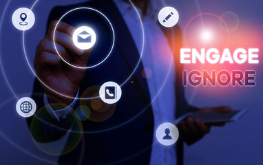 Conceptual hand writing showing Engage Ignore. Concept meaning Silent Treatment Manipulative Punishment Sulking Shunning