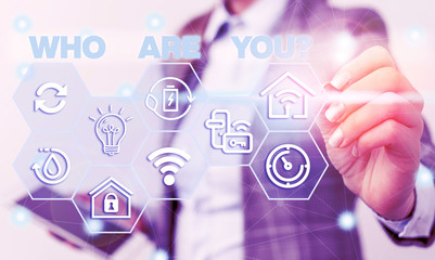 Word writing text Who Are You question. Business photo showcasing asking demonstrating identity or demonstratingal information Female human wear formal work suit presenting presentation use smart