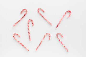 Christmas composition. lollipop canes on white background. new year concept. Greeting card, winter holidays, xmas celebration 2020. Flat lay, top view, copy space, mockup, template