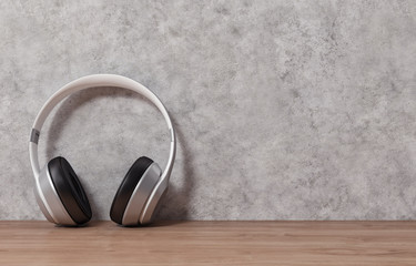 Headphones on wood table and cement background, 3d rendering